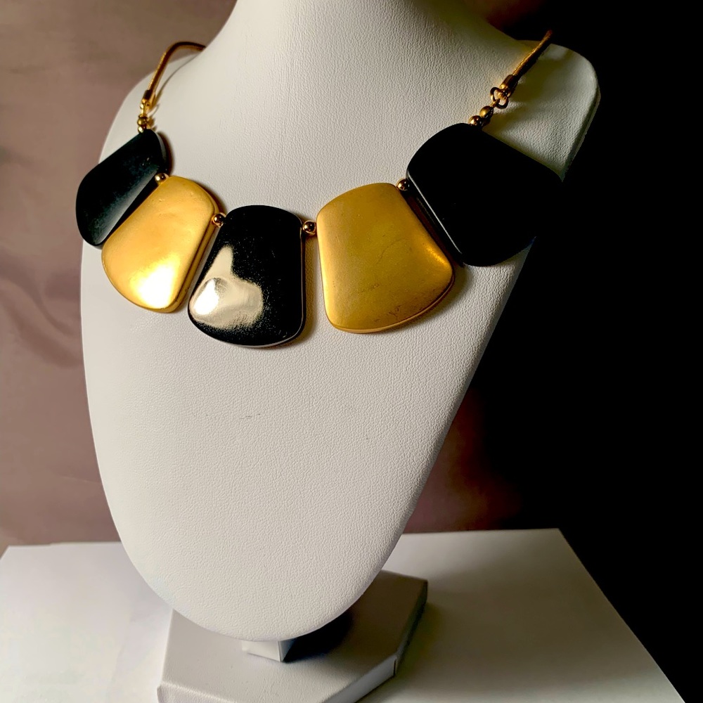 Black and gold colored necklace